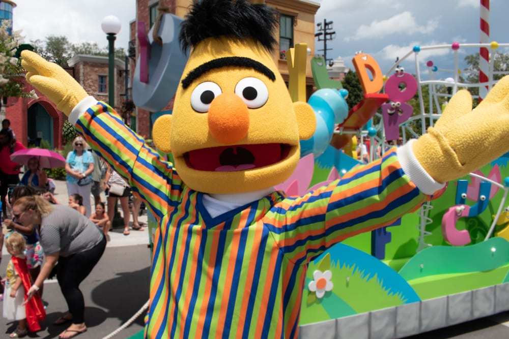 Bert from Sesame Street Waving Arms in the Air at Parade