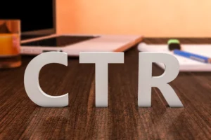 CTR-white-letters-on-desk-laptop-and-notebook-in-background