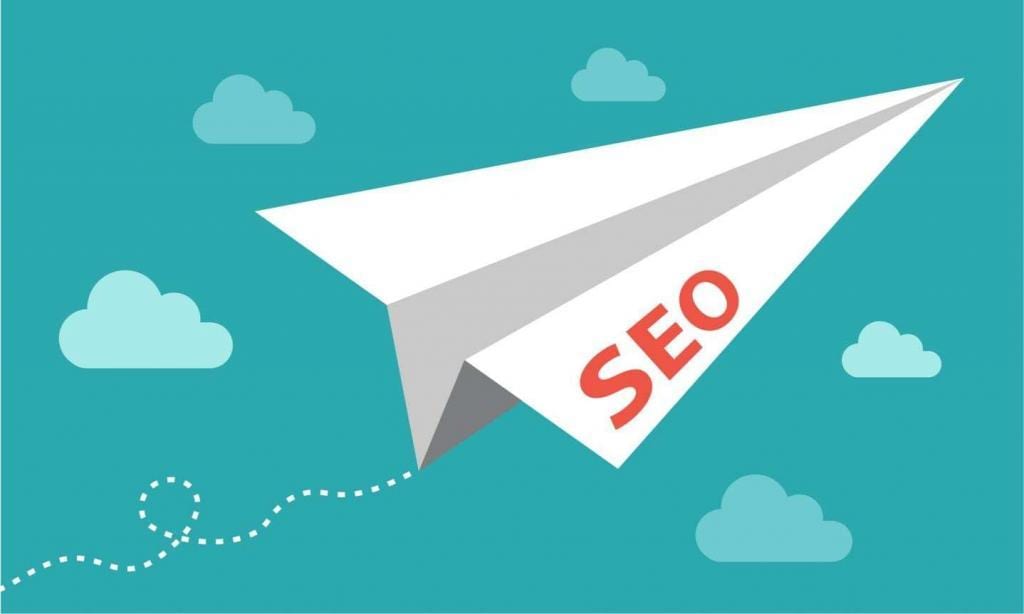 Graphic of paper airplane with SEO on it